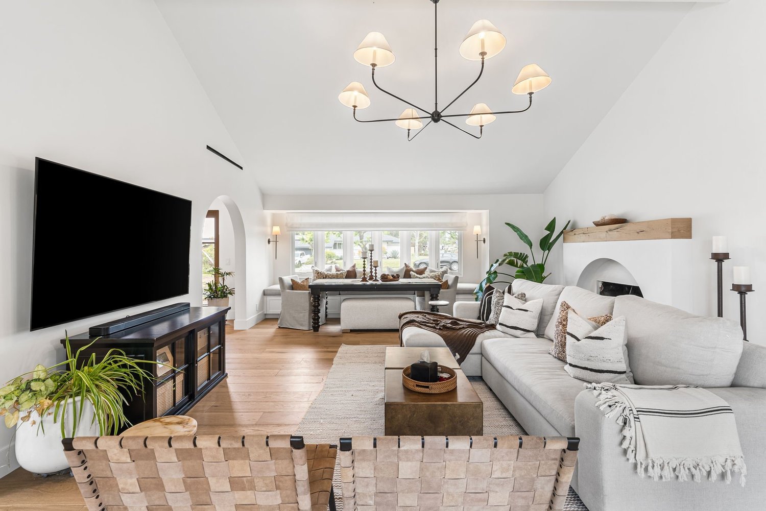 Light-filled luxury kitchen and living interior designed by Gina Lauren Interiors in Orange County