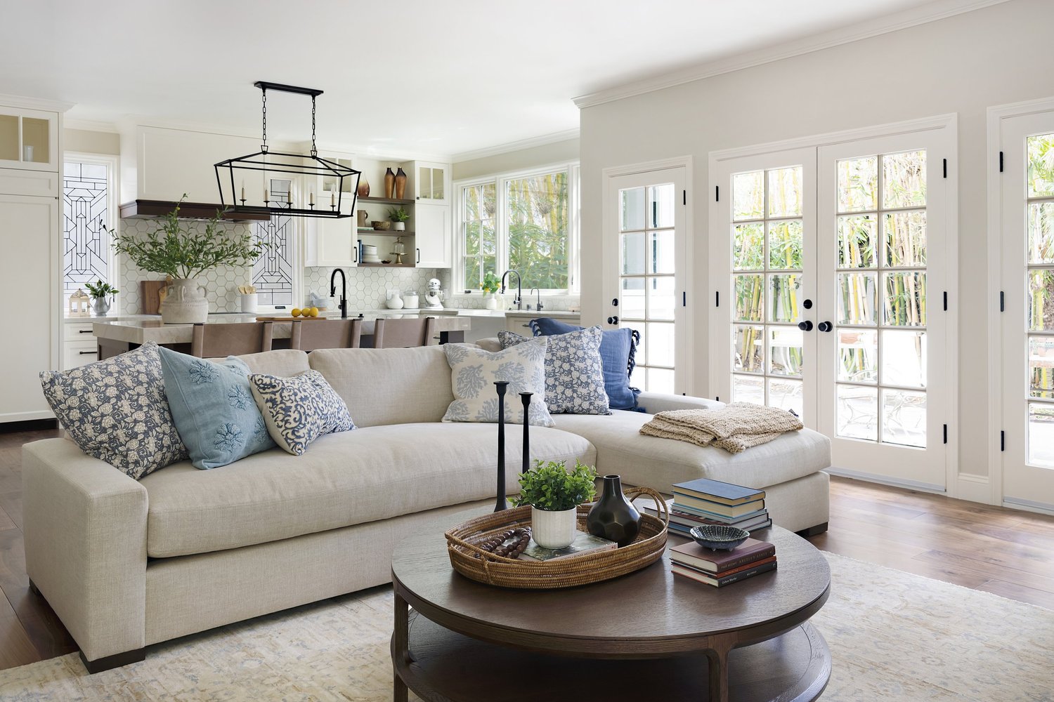 Elegant living room with layered textures and natural light by Gina Lauren Interiors